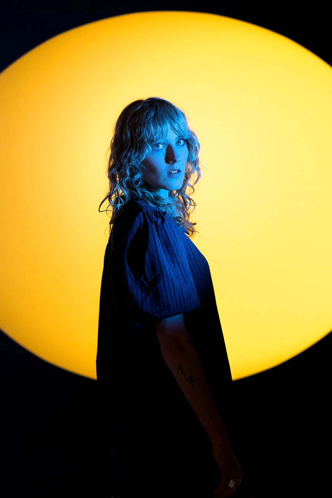 Olivia Carter under amber light